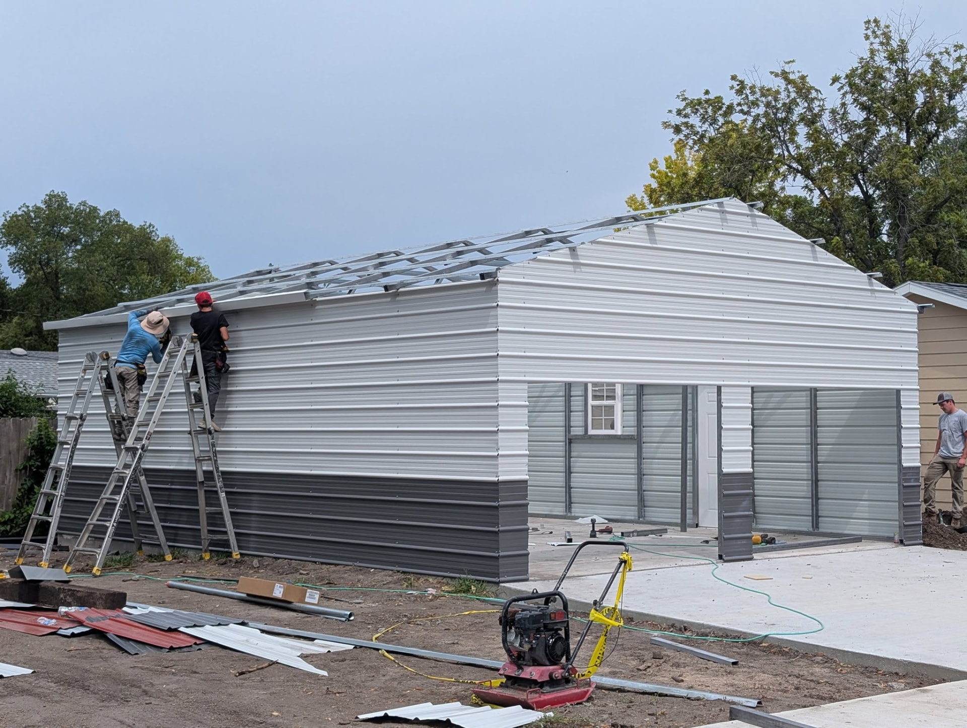 Crew completing the metal garage